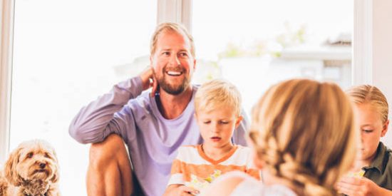 dad-smiling-with-step-children-and-dog