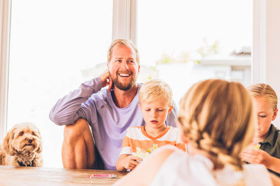 dad-smiling-with-step-children-and-dog