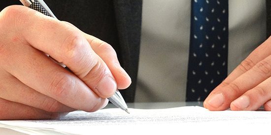 man-signing-legal-document