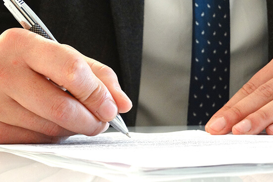 man-signing-legal-document