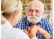 Elderly person reviewing a will with a family member.