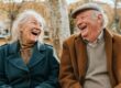 Happy elderly couple in residential care home environment.