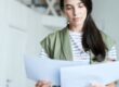 Executor reviewing documents and paperwork for a probate application.